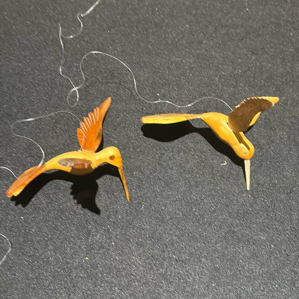 Handmade wooden hummingbirds they hang with fishing line
